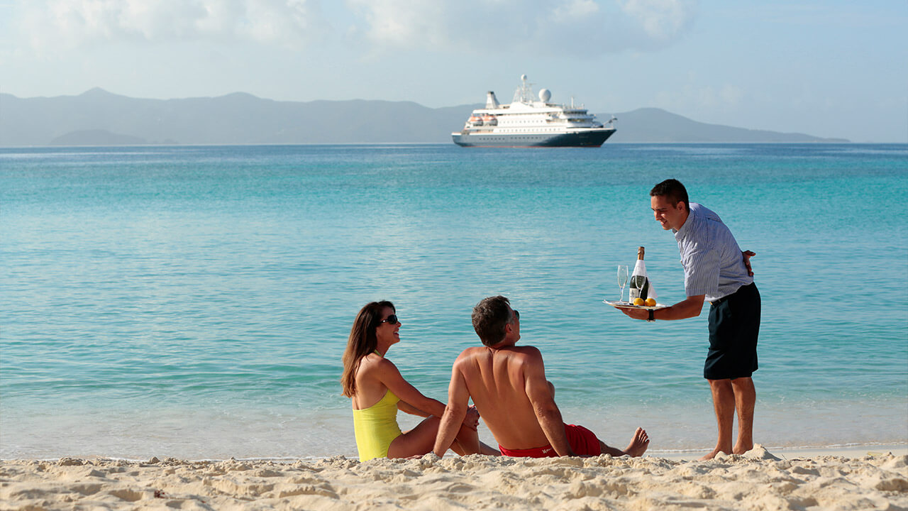 Couple being served on the beach